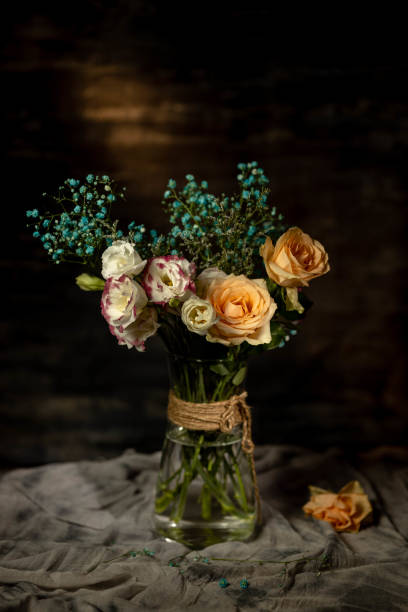 istock retro-style still life: flower and vase, studio shot 1325830624