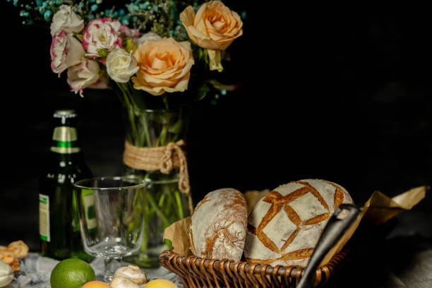 istock still life: rustic bread, beer, fresh fruits and flower vase on table 1325830681