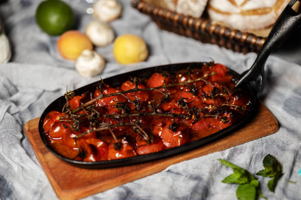istock baked cherry tomato with cast iron baking pan 1325830686