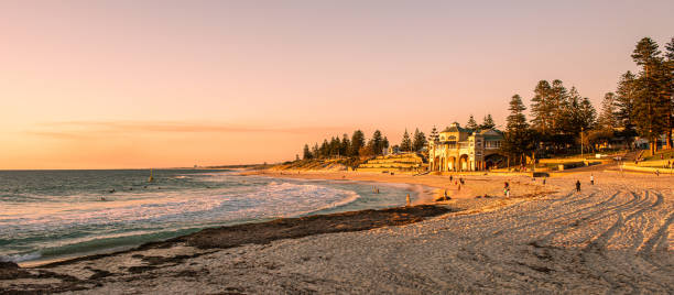 Cottesloe Beach Teahouse Australian landscape, landscape image features the Cottesloe Teahouse on the the beach. People enjoying the sea and sunset cottesloe beach stock pictures, royalty-free photos & images