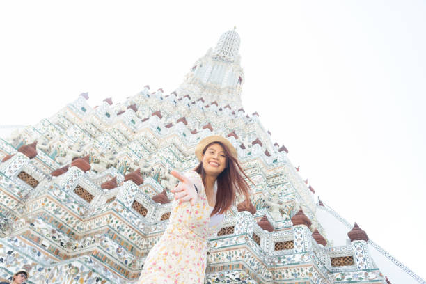 women Asian Thai lady travel in Bangkok , Thailand,Wat Arun is popular travel place for tourist near wat women Asian Thai lady travel in Bangkok , Thailand,Wat Arun is popular travel place for tourist near wat irish travellers photos stock pictures, royalty-free photos & images