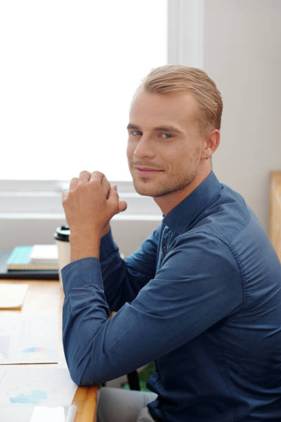 istock Businessman Sitting at Ttable in Office 1325836856