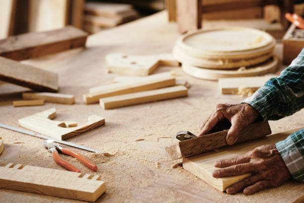 istock Senior Carpenter Polishing Wooden Plank 1325838801