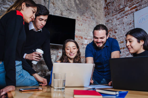 istock Young latin entrepreneurs developing business strategies on computer in modern office 1325839694