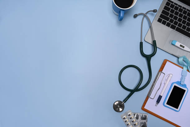 istock Laptop computer, stethoscope, clipboard and coffee cup on doctor workspace. 1325840990