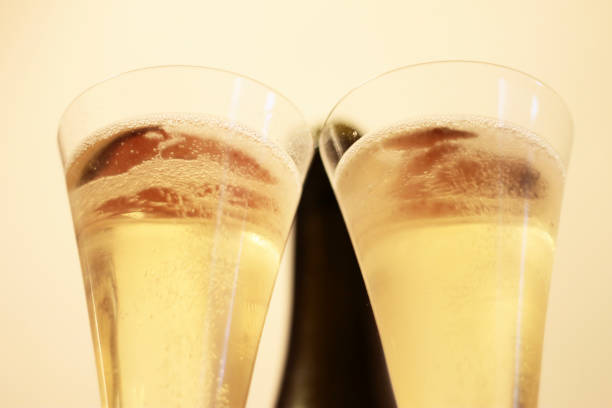 istock Bottle of champagne and a pair glasses before drinking 1325841076