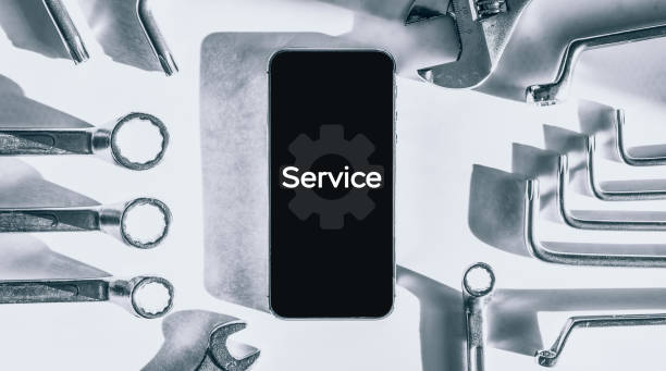 istock Phone service. Technician workplace with phone and special repairing tools. Cellphone technology device maintenance engineer. 1325842951