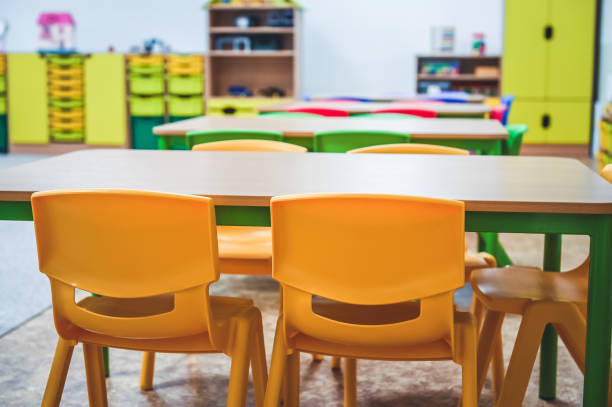 istock Chairs, table and toys. Interior of kindergarten. 1325844881