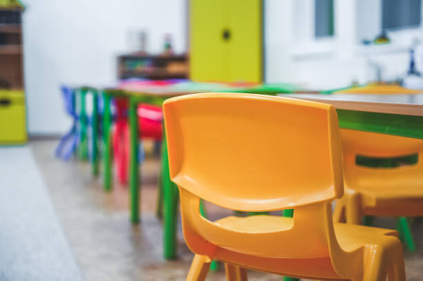 istock Chairs, table and toys. Interior of kindergarten. 1325844888