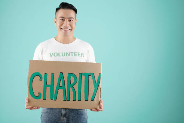 istock Volunteer Showing Big Placard 1325845072