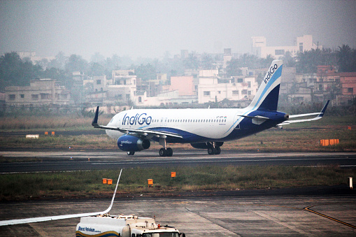 Patna, India - December 15, 2014: Indigo's airplane standing on airport runway.