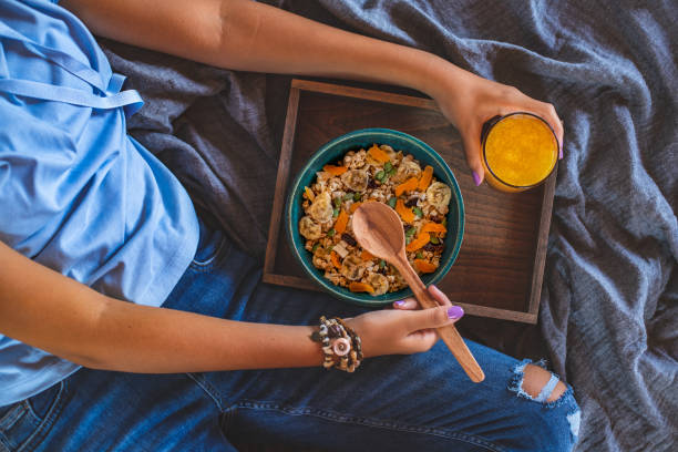 istock An unrecognized woman holding a muesli in a bowl at her hands. 1325850393