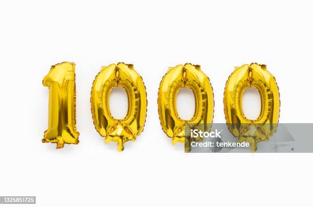 Number 1000 One Thousand Golden Foil Balloon Party Decor On White Background Birthday Anniversary Stock Photo - Download Image Now