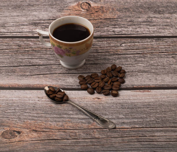 istock dark coffee and grains on wooden background 1325852298