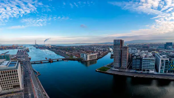 Dublin  Ireland - May 2020 : Aerial view of Dublin dockland district with the Capital Dock apartment block in the centre Dublin city view over Liffey River .Samuel Beckt and Sean O' Casey Bridge