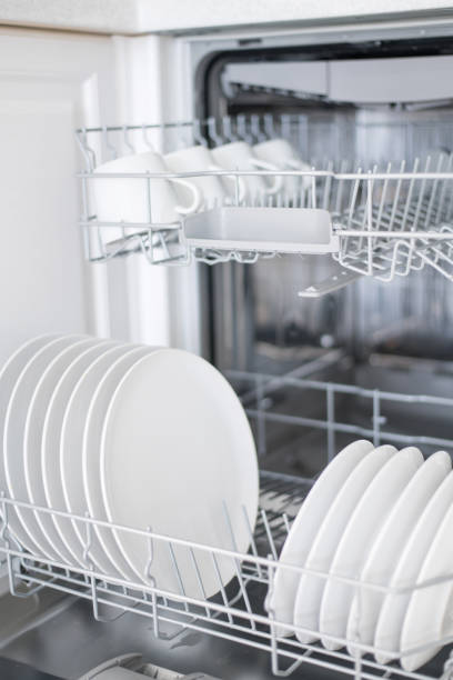 istock White flat plates are loaded into the dishwasher 1325853652