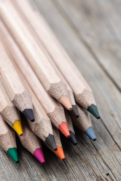 istock Close up of colored pencils on a wooden surface. 1325853785