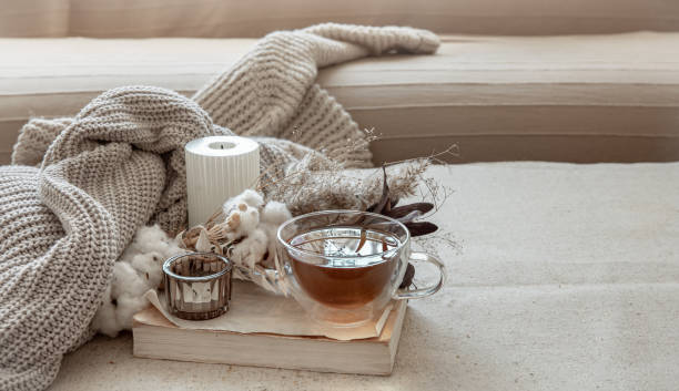 istock Cozy composition with tea, dried flowers and home decor details. 1325854217