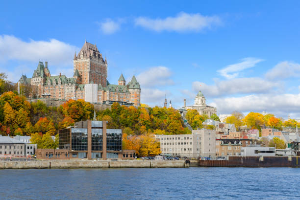Autumn view of Old Quebec City waterfront from Saint-Lawrence Riverr in Quebec, Canada Cityscape view of Old Quebec City waterfront and Upper Town from Saint-Lawrence River in Quebec, Canada chateau frontenac hotel stock pictures, royalty-free photos & images