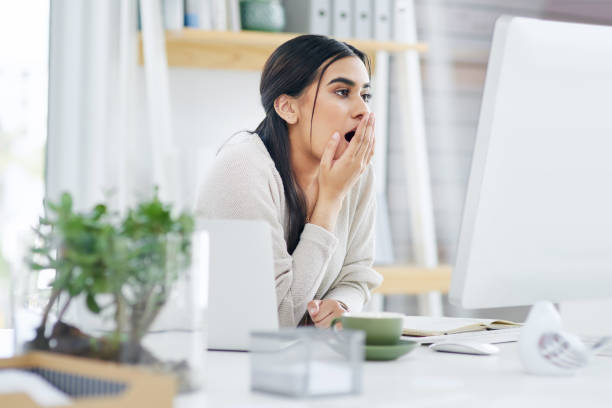 istock Shot of a young businesswoman looking shocked while using a computer in an office 1325855477