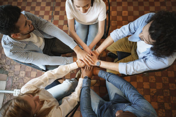 istock Top view of diverse people hands holding together in circle, hands stack 1325855558