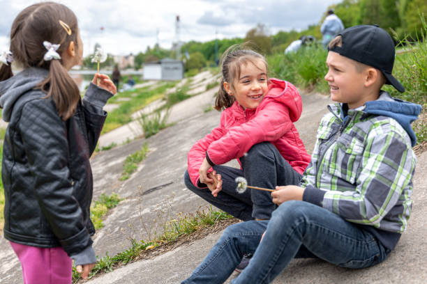istock Small children sit and communicate together during a walk. 1325855896