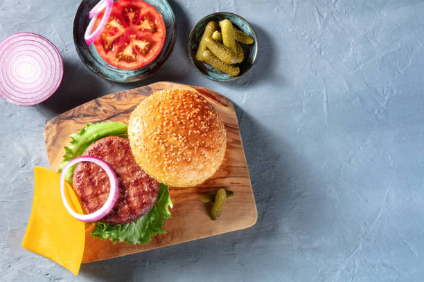 istock Burger ingredients with copy space, shot from above. Hamburger beef patty etc 1325856107