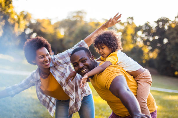 istock Happy child  having fun with her parents in nature. 1325856167