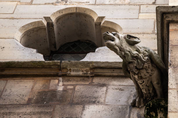 istock Stone gargoyle on the wall of ancient cathedral 1325858207