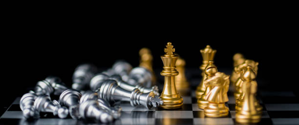 istock chess board game in competition play, Ideas business success concept 1325859614