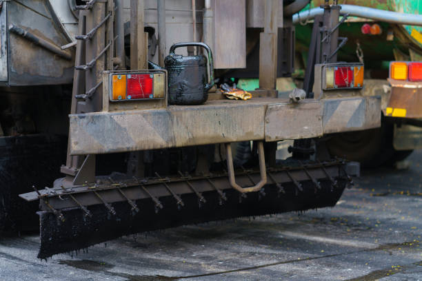 istock Asphalt paver machine during road work, Road Machinery at construction site for paving works, Screeding the sand for road concreting 1325859617