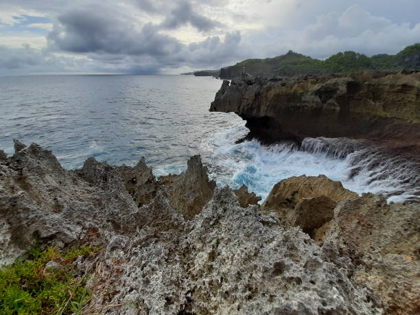 istock Crashing water hits rocks at Midodaren beach 1325860236
