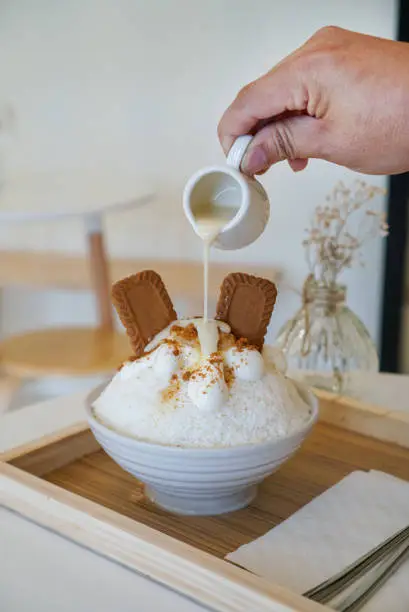 Photo of Banana and Cookies Bingsu or Bingsoo, a traditional Korean sweet dessert.