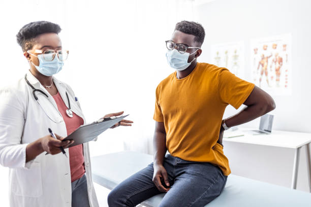 istock Male Patient in a visit at physical therapist's office 1325865367