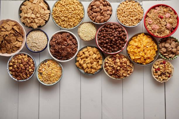 istock Assortment of different kinds cereals placed in ceramic bowls on table 1325865663