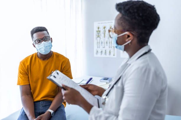istock Female doctor holding application form while consulting patient 1325865724
