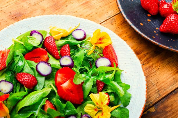 istock Summer salad with berries and herbs 1325865962