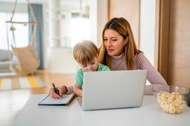 istock Mother working at home-office with child on her lap 1325868196