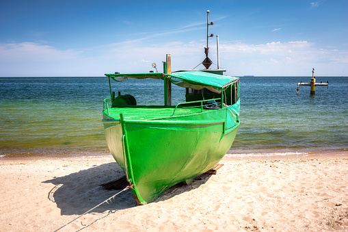 Summer scenery of the Baltic Sea with fishing boat in Gdynia Orlowo, Poland