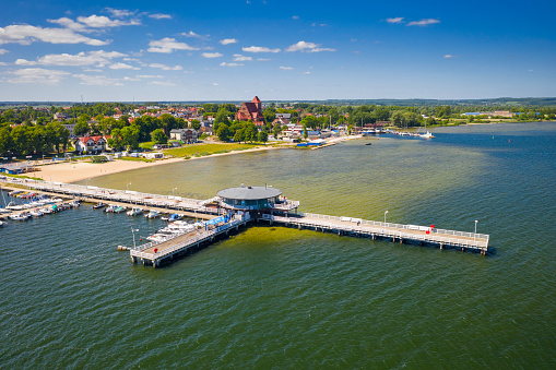 Pier and beach in Puck on the Bay of Puck at summer. Poland