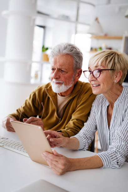 istock Senior retired couple learn about computer and online support. 1325870579