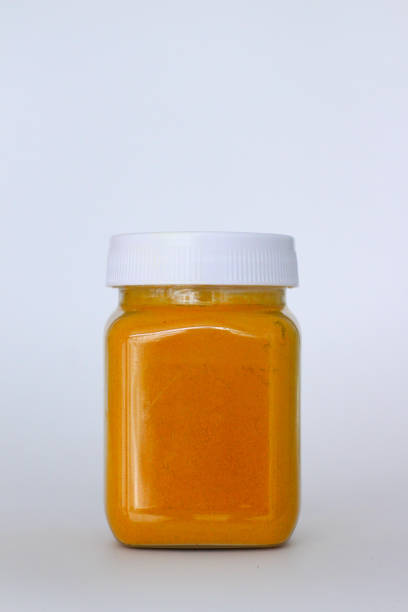 istock Turmeric powder in a glass bowl 1325872434