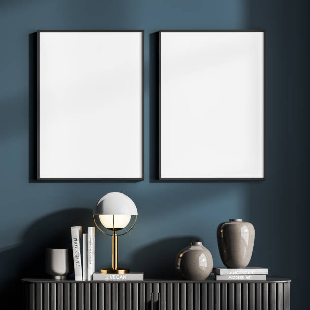 istock Minimalist style blueish living room interior with bookshelf and two vertical posters 1325872449