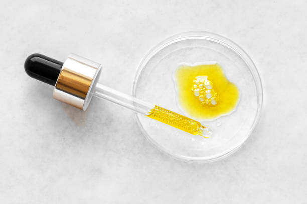 istock Liquid yellow cosmetic serum and dropper 1325872521