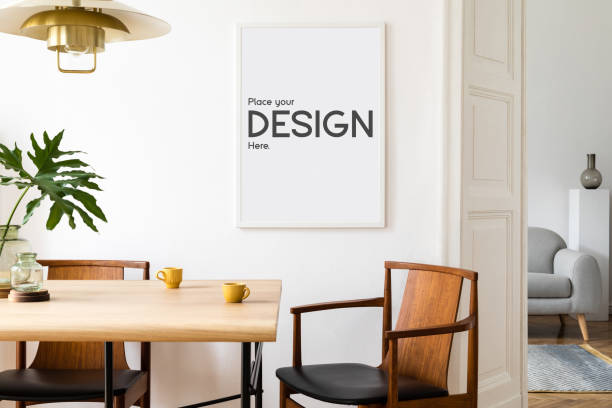 istock Stylish and eclectic dining room interior with mock up poster map, sharing table and accessories. Template. 1325872550