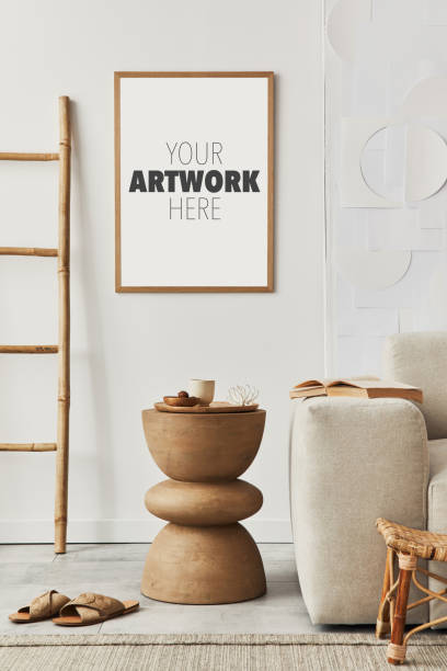 istock Stylish composition of classy living room interior with mock up poster frame, coffee table, sofa, carpet and accessories. Beige walls. Template. 1325872591