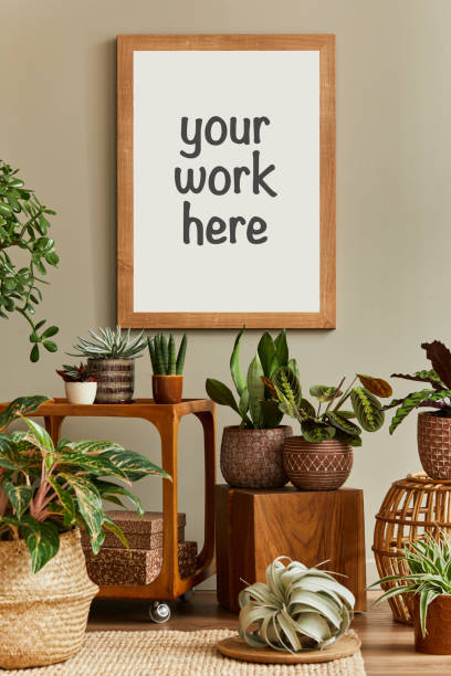 istock Creative composition of cozy plants lover home interior design with mock up poster frame. Template. 1325873175