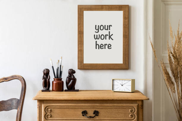 istock Minimalistic composition with wooden vintage commode and brown mock up photo frame. Template. 1325873182