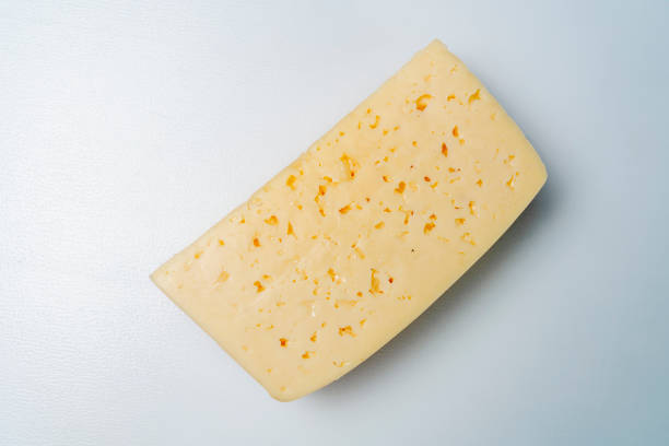 istock Top view cheese against white background. Closeup. 1325877559