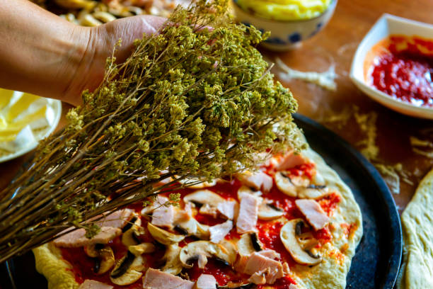 istock Preparing the Italian pizza with oregano 1325878076